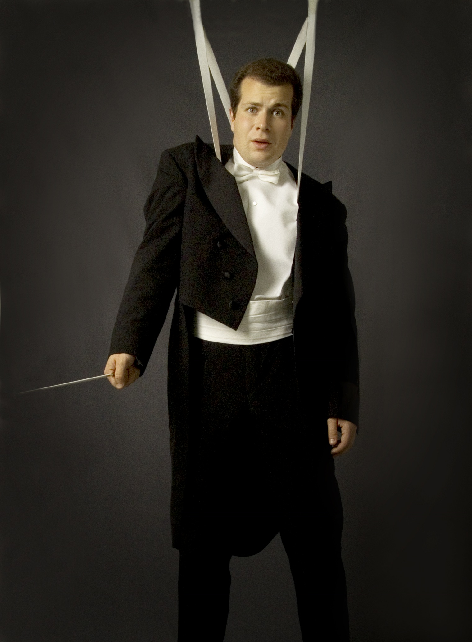 Stefan Solyom in tails, tangled in his own suspenders